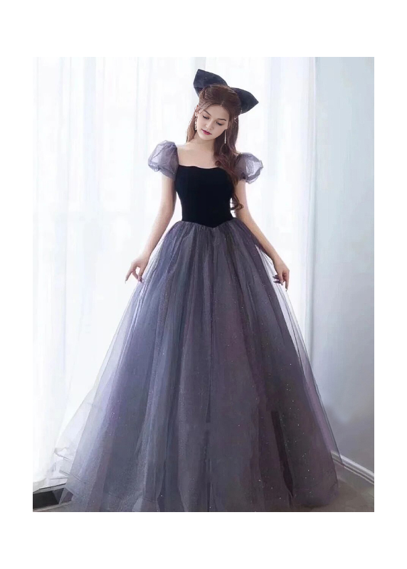 Evening gown in glittering gray tulle and black velvet with puff sleeves