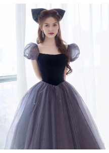 Evening gown in glittering gray tulle and black velvet with puff sleeves