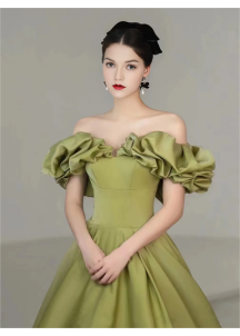 Green satin evening gown with off-the-shoulder bodice