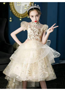 Vestido de dama de honor para niña en tul dorado brillante con falda asimétrica