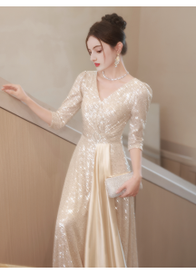 Shimmering sequin evening gown with long sleeves