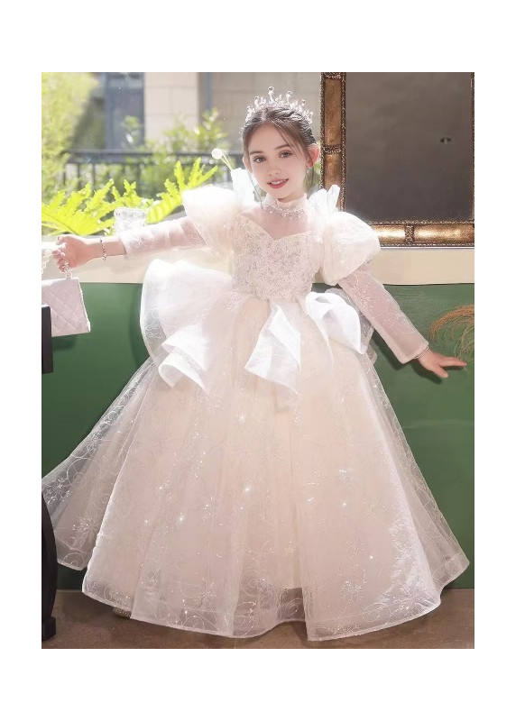 robe baptême en tulle blanc à paillettes argentées jupe ample avec drapé asymétrique