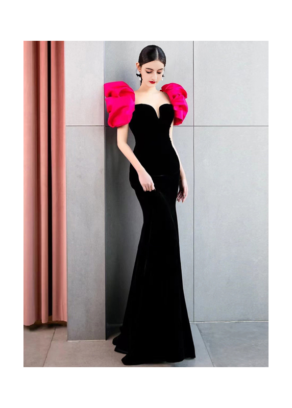 Black velvet evening gown with pink puff shoulders