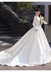 Classic white satin wedding gown with long sleeves