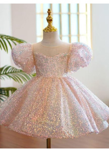 robe de fête petite fille recouverte de sequins rose avec grand nœud assorti