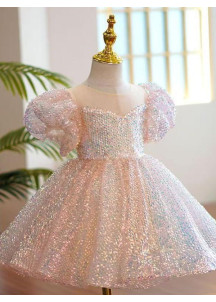 robe de fête petite fille recouverte de sequins rose avec grand nœud assorti