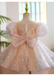 robe de fête petite fille recouverte de sequins rose avec grand nœud assorti