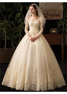 Wedding dress with a lace bodice and long sleeves