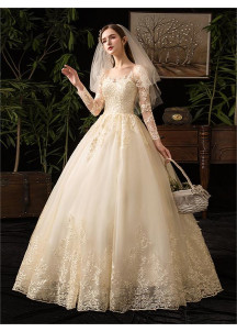 Wedding dress with a lace bodice and long sleeves