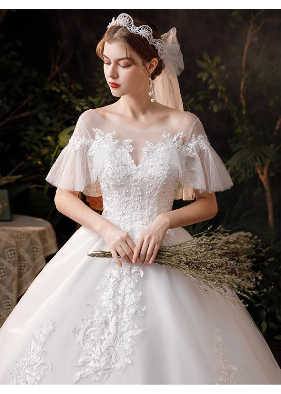 Wedding dress with short puffy sleeves and a long train