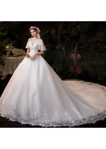 Wedding dress with short puffy sleeves and a long train