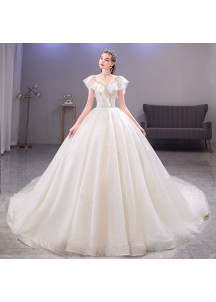 Vestido de novia ampuloso de tul brillante con escote abullonado