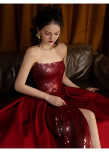 Burgundy red strapless evening gown with sparkling sequins